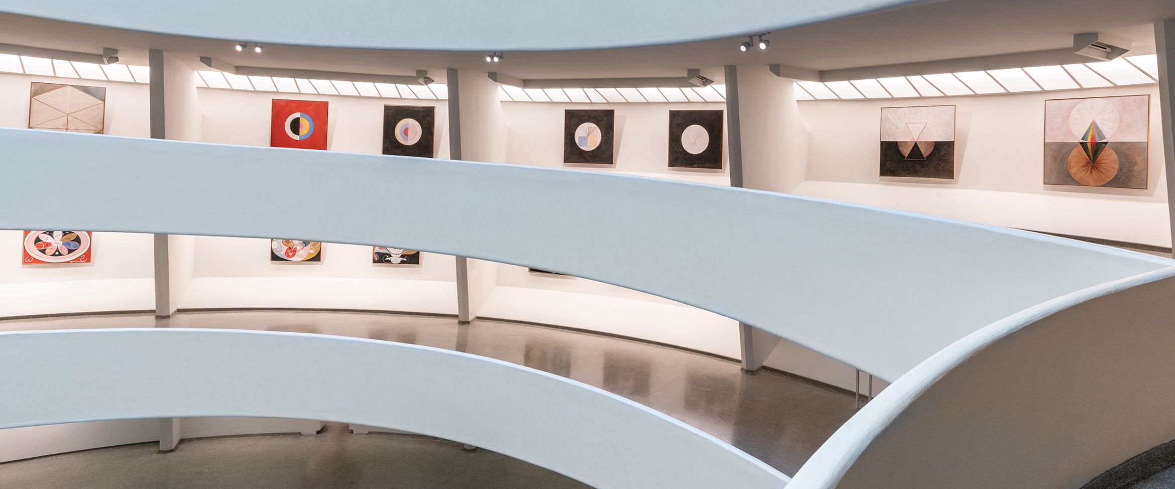 Photo showing array of portraits in physical context, on a path